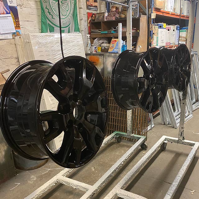 Row of Black powder coated alloy wheels