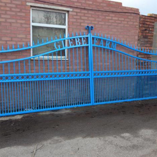 Large blue powder coated gates outside drying