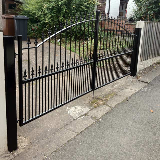 Front drive black powder coated closed gates