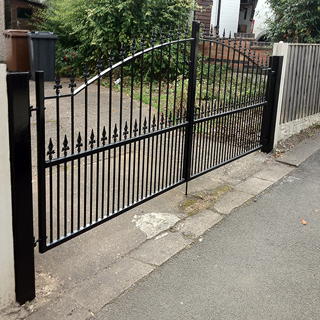 Front drive black powder coated closed gates