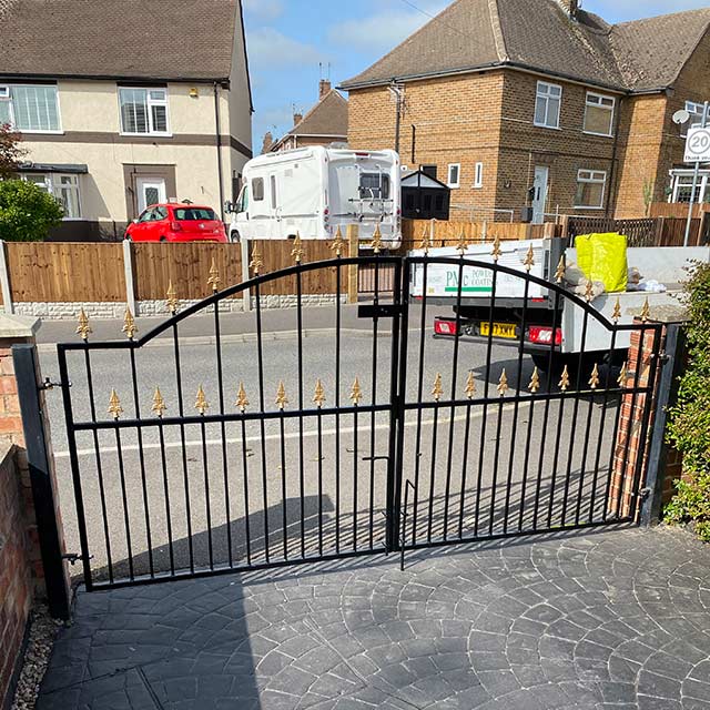 Front drive black powder coated closed gates