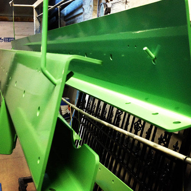 Green powder coated metal work
