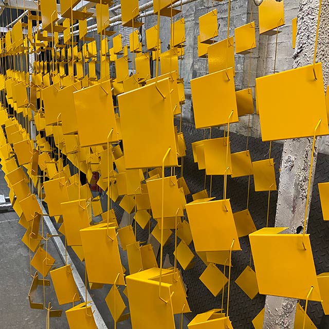 Hanging yellow powder coated fixings