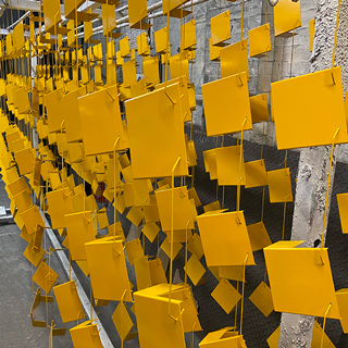 Hanging yellow powder coated fixings